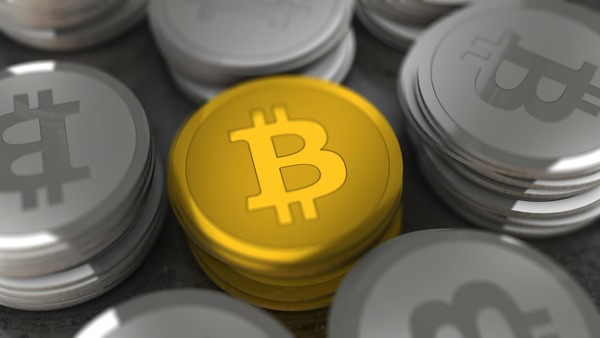 Stack of gold and silver cryptocurrency coins